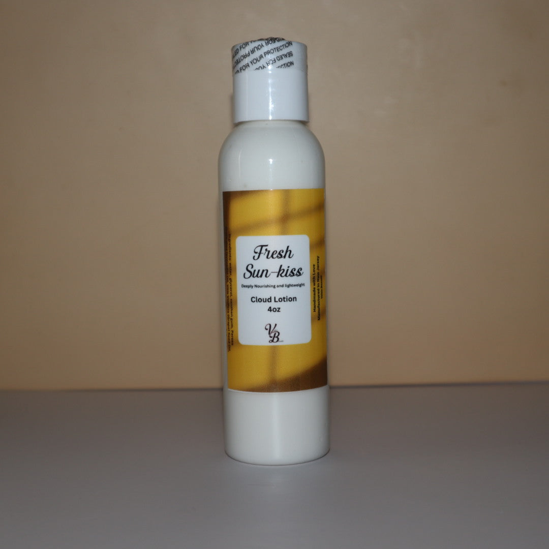 Bottle of 'Fresh Sun-kiss' cloud lotion with a white label on a beige background